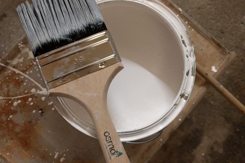 Paint bucket and brush ready for work